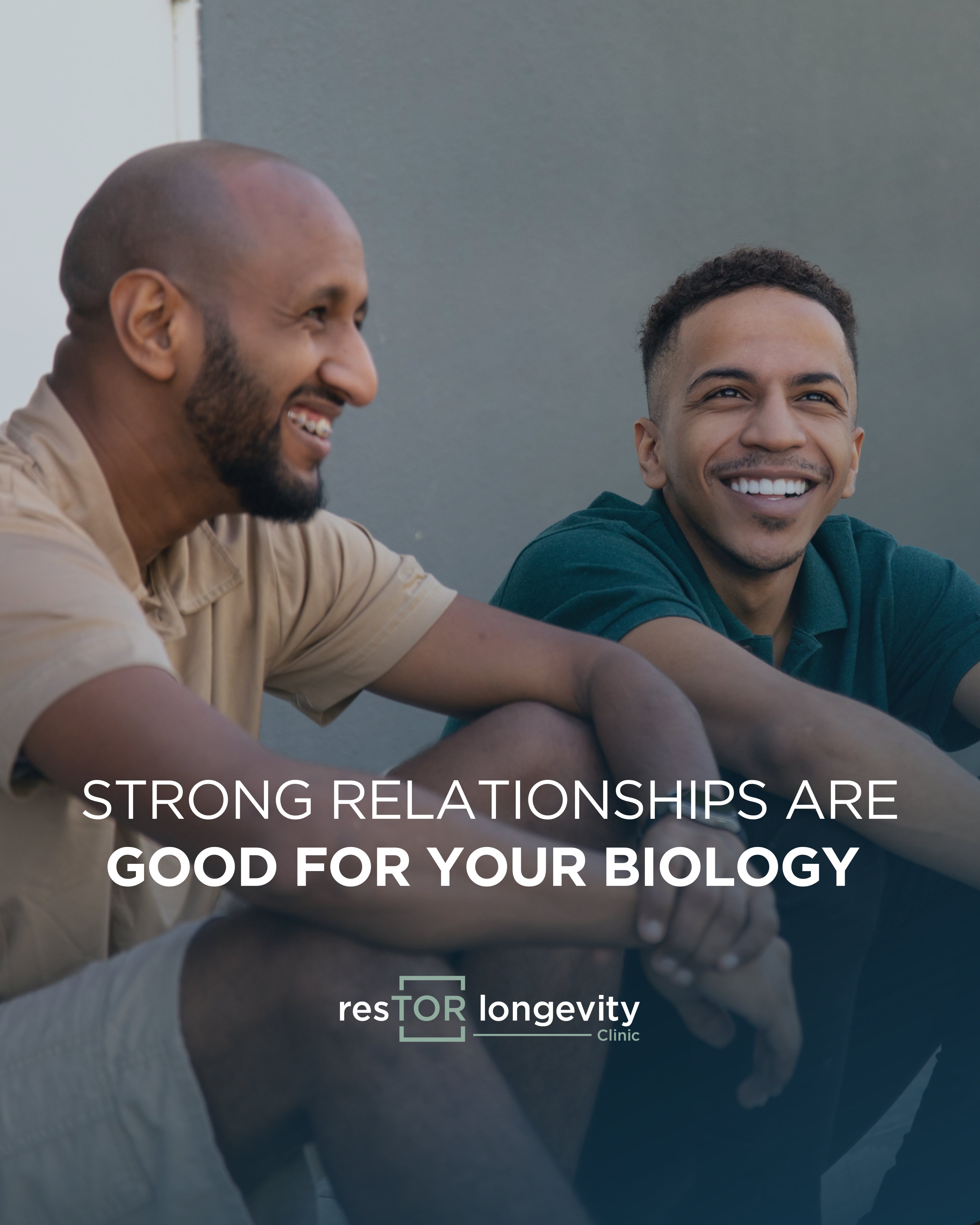 Two men smiling with information about health benefits of strong social connections by Dr. Gregory Burzynski at resTOR Longevity Clinic in Houston, Texas.